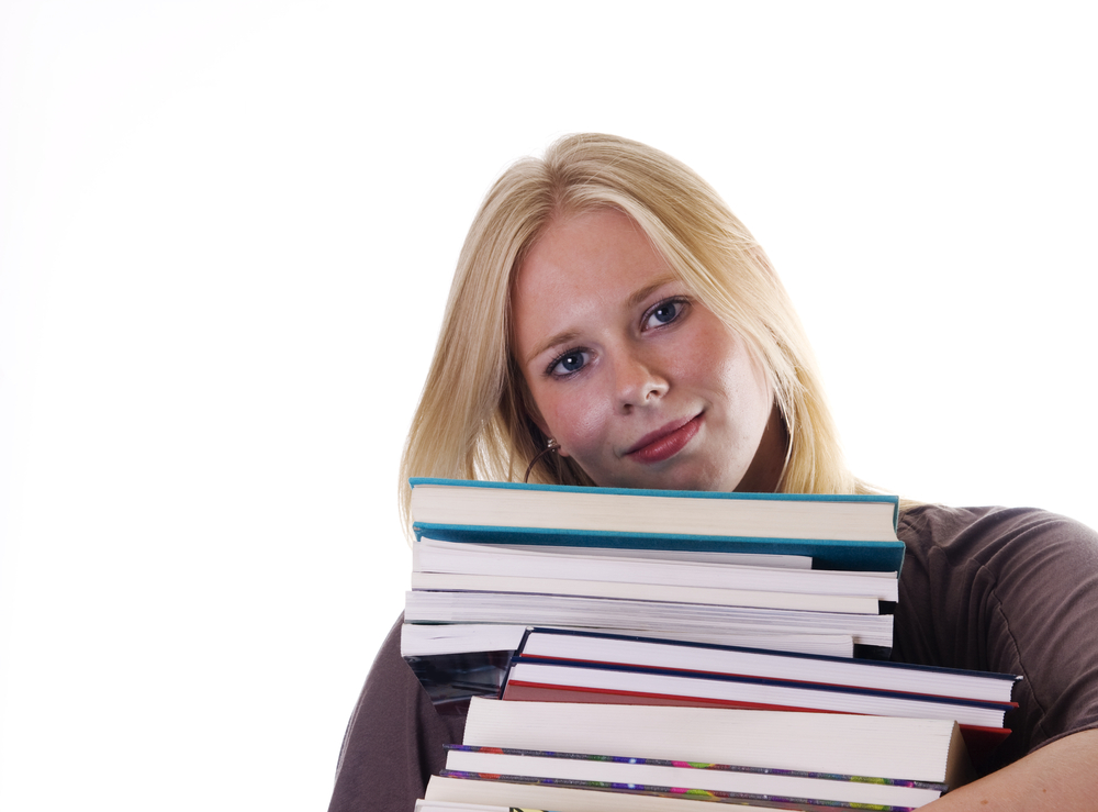 young woman carrying books