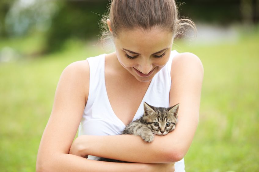 Woman with pet kitten